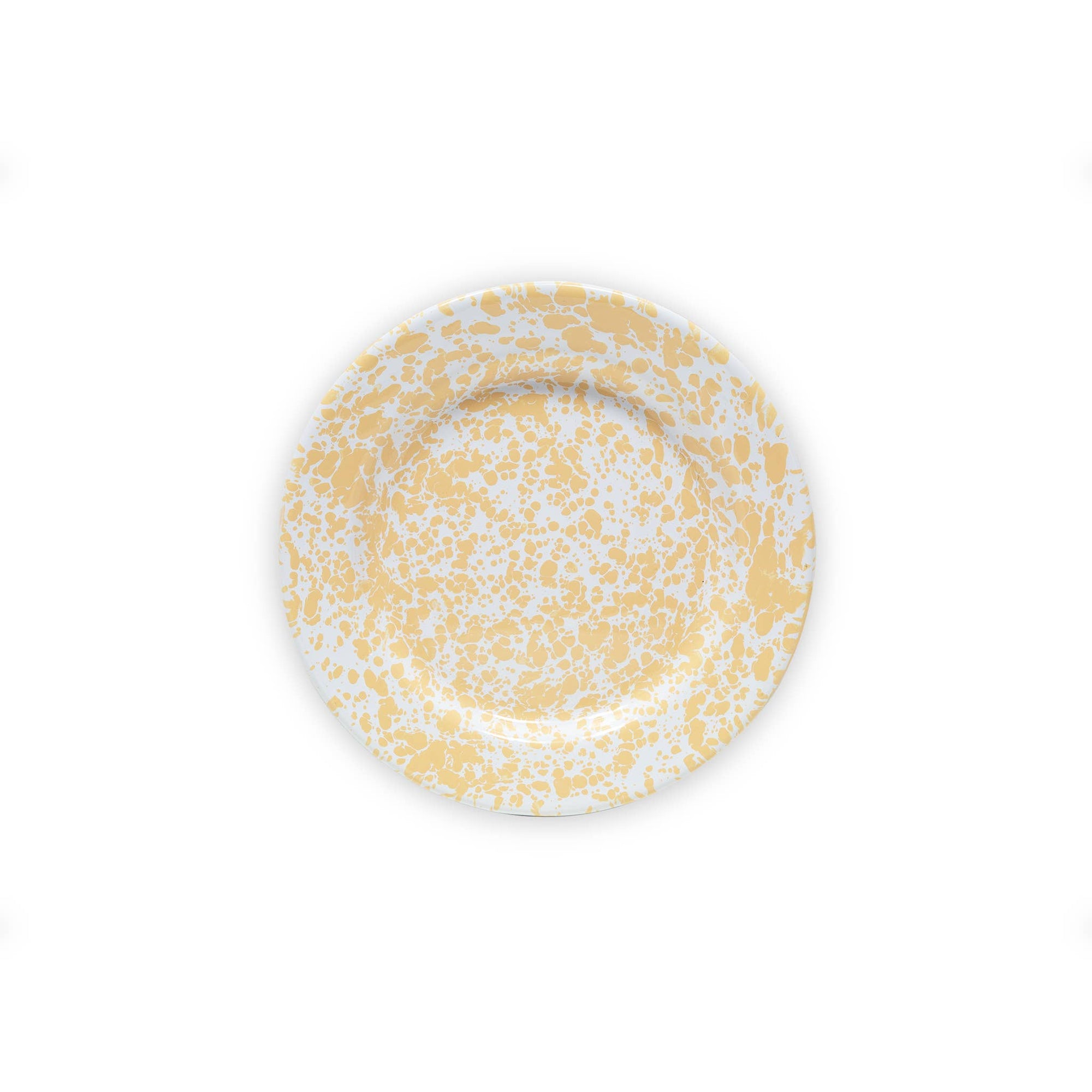 The Splatter Enamelware Flat Salad Plate, featuring a vibrant yellow and white splatter pattern on its round surface, is viewed from above. Set against a plain white background, the durable plate proudly displays its versatile design.