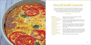 An open egg-themed cookbook displaying a recipe page for "broccoli soufflé casserole" beside a skillet containing the prepared dish with eggs, tomato, and egg.