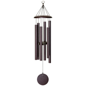 The Corinthian Bells® 36-inch Windchime is a versatile wind chime with cylindrical tubes of varying lengths, hanging from a circular top and a round weight at the bottom, that complements any landscape design. It adds a melodic touch to your outdoor space.