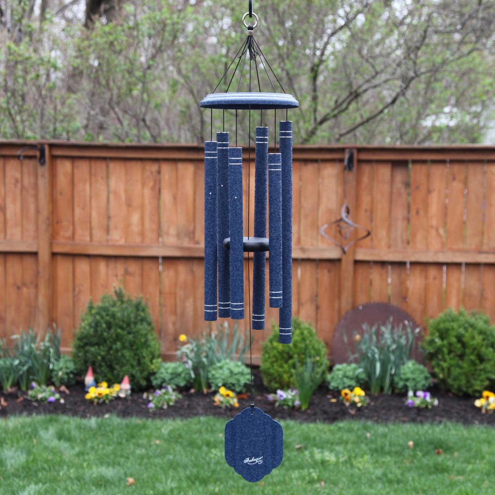 A unique 36" Windchime Arabesque® hanging in a backyard, perfect for holidays and birthdays.