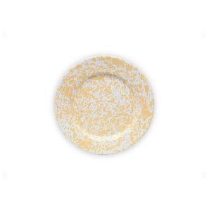 The Splatter Enamelware Flat Salad Plate is a round white plate with a yellow splatter pattern and an enamel finish, displayed centered on a plain white background.