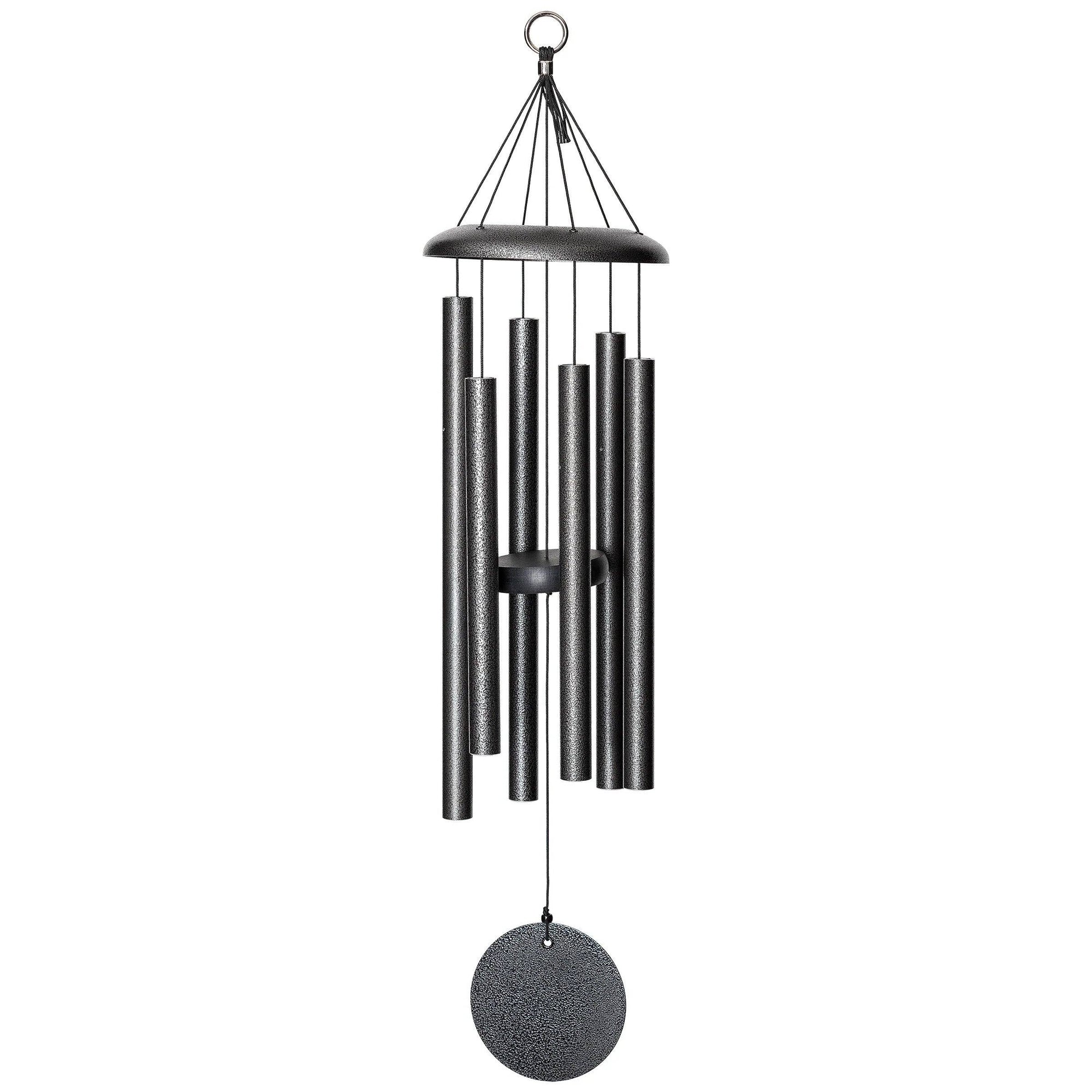 A Corinthian Bells® 30-inch Windchime hanging on a small patio.