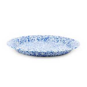 The Splatter Enamelware Large Round Tray features a captivating blue and white speckled pattern, making it perfect for entertaining.