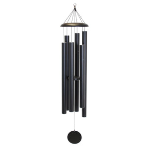 The Corinthian Bells® 65-inch Windchime features six black metal tubes hanging from a circular top with a round wind catcher, delivering deep resonance and a soothing sound. Available wholesale.