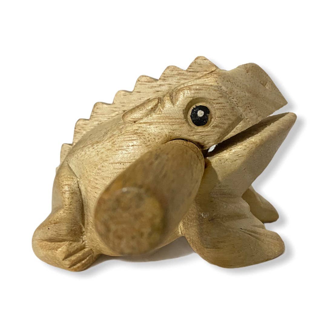 A premium Natural wooden frog, handmade in Thailand, skillfully showcasing quality craftsmanship with a mallet in its mouth.