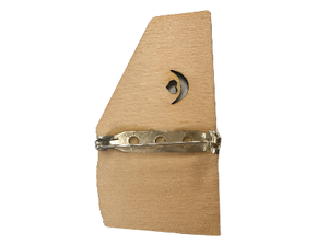 The Autoharp Wooden Pin features a crescent moon and star cutout, crafted from wood with a secure metal clasp on the back for easy attachment.