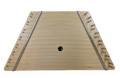 Lap Harp Birch is a trapezoidal wooden acoustic folk instrument featuring multiple metal strings and tuning pegs on both sides.