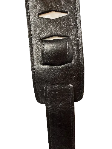 Close-up of the Lock-It Black Leather Strap, featuring rectangular cutouts and visible stitching.