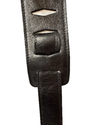 Close-up of the Lock-It Black Leather Strap, featuring rectangular cutouts and visible stitching.