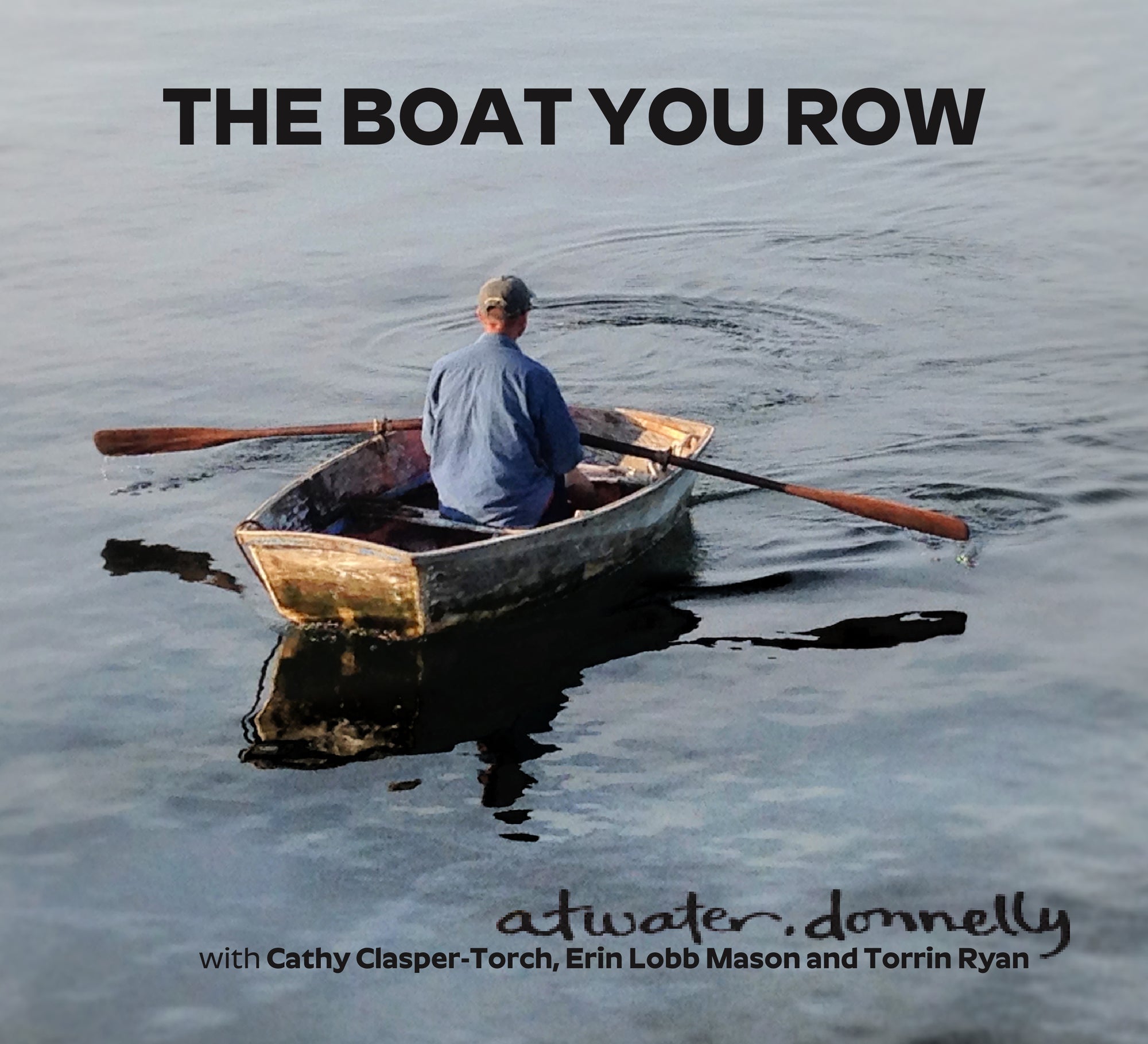 Wearing a blue shirt, an individual rows a small wooden boat on tranquil water, reflecting the calming essence of archival American folk songs. The text above and below the image complements this scene, connecting timeless traditions with "The Boat You Row" by Aubrey Atwater.