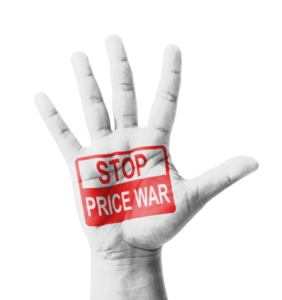 A raised hand with "STOP PRICE WAR" in red text on the palm, urging not to sacrifice value for product zero price, isolated on a white background.