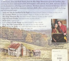 CD cover titled "Heirlooms" by Steve and Ruth Smith, featuring an image of a rustic barn with mountains in the background. To the right, there's a list of song titles beside a picture of Steve and Ruth Smith holding their instruments. At the bottom, you'll find pricing details along with website information.