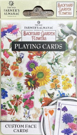 Deck of playing cards with a floral design titled "Leaning Tree Farmers Almanac Flowers Playing Cards." Perfect for family nights, the package features colorful flower illustrations, ideal for matching games during holiday gatherings.