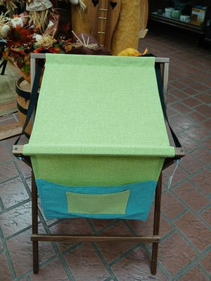 Sling Music Stand featuring a lime green fabric surface and a teal front pocket on a wooden foldable frame.