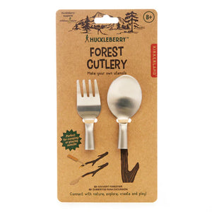 Packaging of Huckleberry Forest Cutlery with pieces to make a beechwood fork and spoon, marketed for ages 8 and up, emphasizing creativity and outdoor exploration.