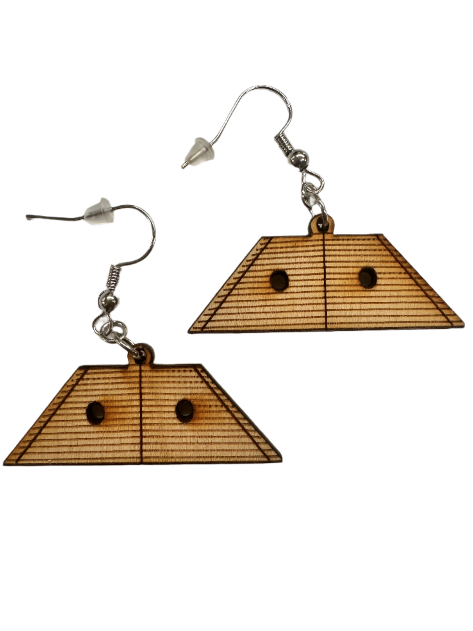 Hammered Dulcimer Wooden Earrings: Trapezoid-shaped wooden earrings with engraved lines, two circular holes per earring, and metal hooks with clear plastic stoppers.