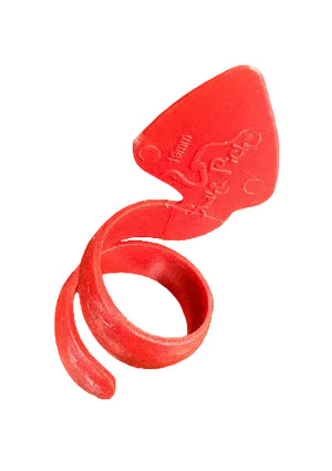 A red plastic SnakePick tool with a spiral shape and flat end, labeled "16mm Pipe Peeler," rests on a wooden surface.