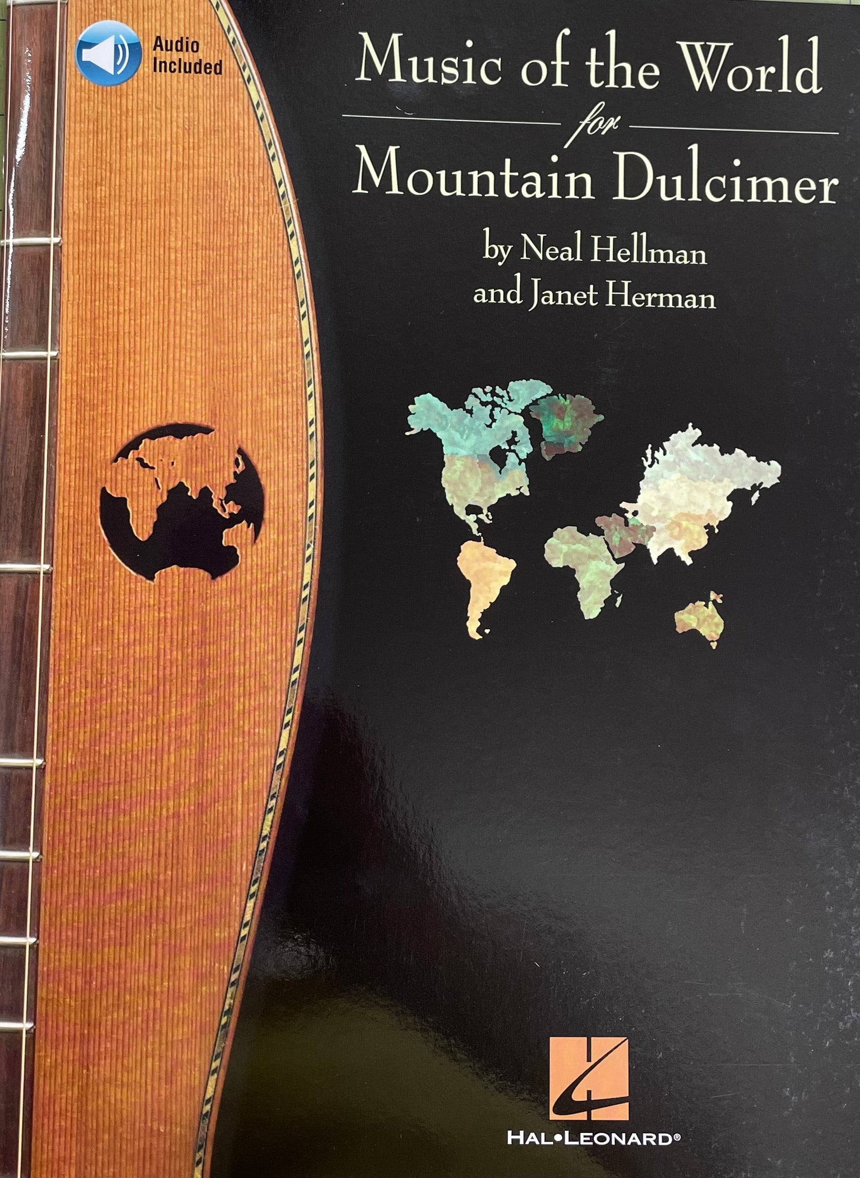A mountain dulcimer next to "Music of the World for Mountain Dulcimer" by Neal Hellman and Janet Herman, featuring tablature and musical notation, published by Hal.