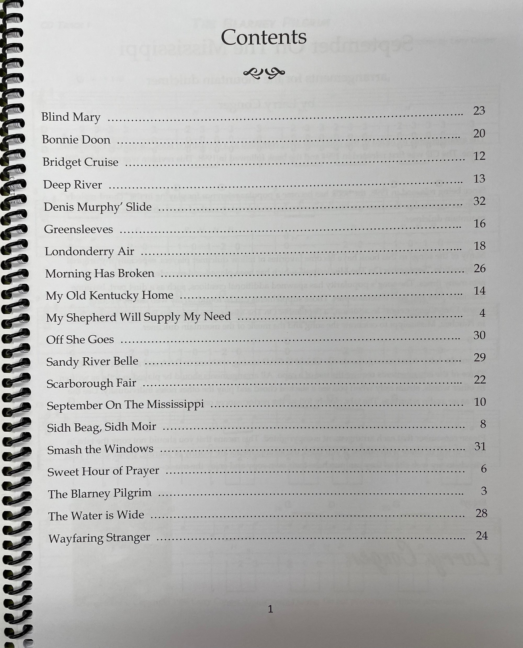 A photograph of a table of contents from "September on the Mississippi Mountain Dulcimer Solos by Larry Conger", listing various song titles with corresponding page numbers.