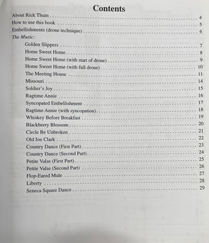 Contents page of a music book listing "Hammered Fiddle Tunes by Rick Thum," using the hammered dulcimer, embellishments, and 23 songs, including traditional American fiddle tunes like "Golden Slippers," "Home Sweet Home," and "Ragtime Annie," with corresponding page numbers.