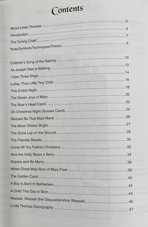 Table of contents for *An Old English Christmas for Hammered Dulcimer by Linda Thomas*, listing various carols and their page numbers, such as "Children's Song of the Nativity" on page 10 and "The Boar's Head Carol" on page 18, featuring arrangements in standard notation.