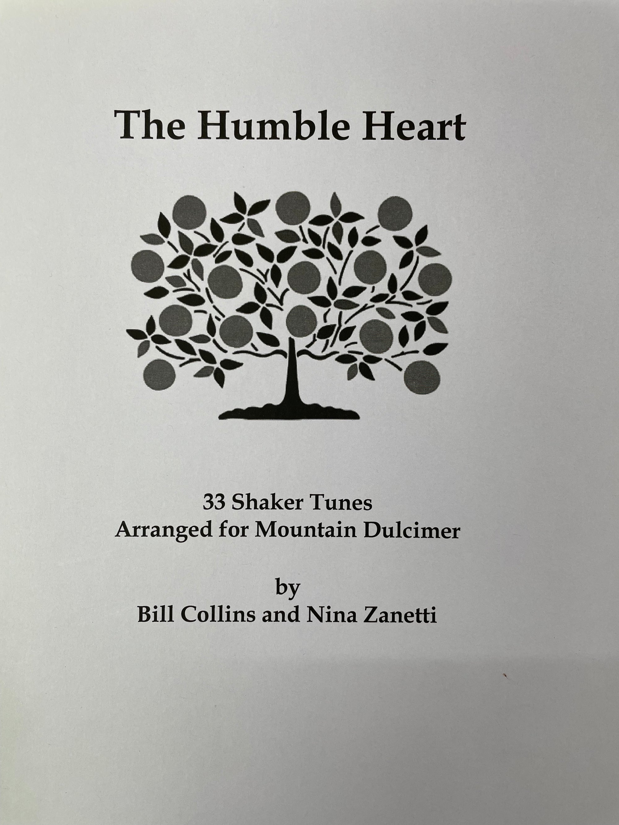 Cover of "The Humble Heart" by Bill Collins and Nina Zanetti features 33 Shaker tunes arranged for mountain dulcimer, adorned with an elegant tree illustration. Discover melodies in DAD and DAC tunings for a fulfilling musical experience.