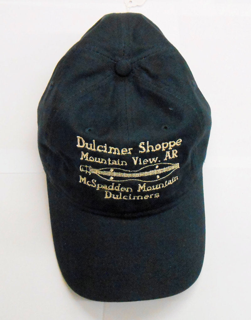 A Dulcimer Shoppe Cap - Navy with a gold logo on it.