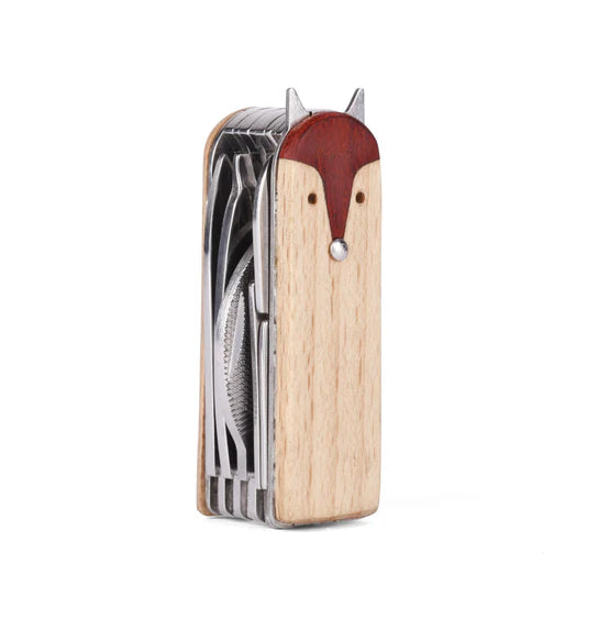 A stainless steel Fox Manicure Set with various utensils folded inside, isolated on a white background.