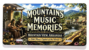 Introducing our NEW Vanity Plates: This decorative license plate showcases musicians playing instruments—including the mountain dulcimer—set against a scenic backdrop of mountains and the town of Mountain View, Arkansas. Featuring the text “Mountains Music Memories, Mountain View, Arkansas, Folk Music Capital of the World,” it celebrates the rich folk music heritage of Mountain View.