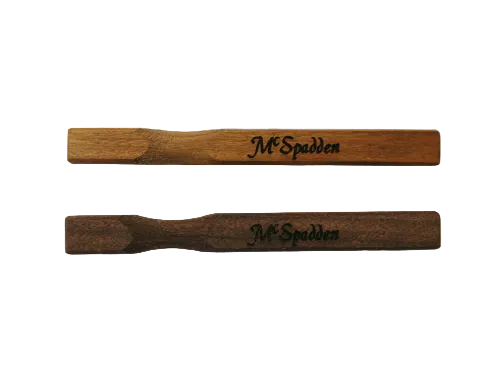 Two McSpadden Noters, crafted from quality wood and engraved with the McSpadden name, are placed side by side on a plain white background.