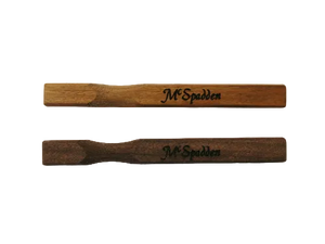 Two McSpadden Noters, crafted from quality wood and engraved with the McSpadden name, are placed side by side on a plain white background.