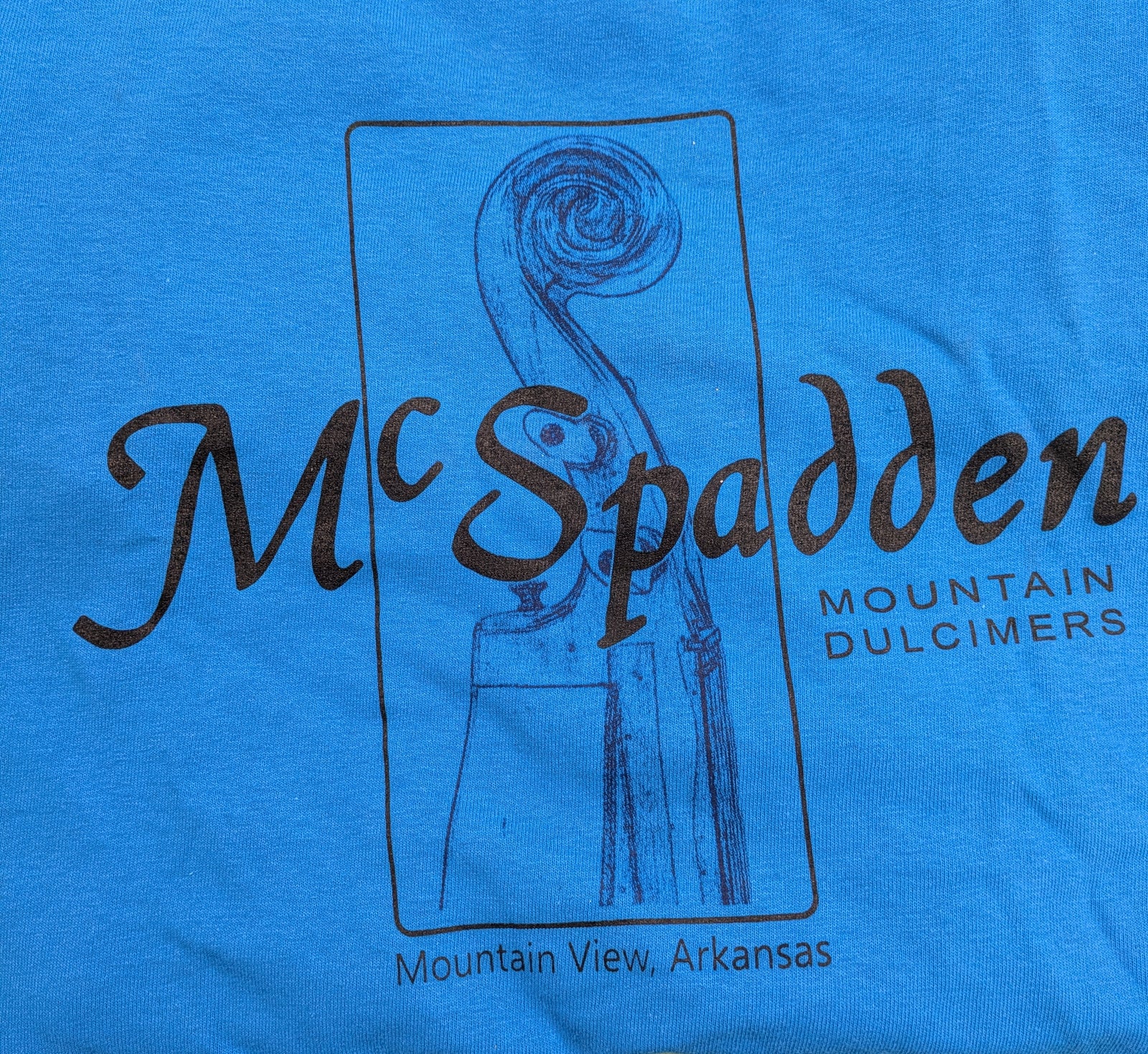 Blue Long Sleeve T-shirt - Scroll Head Design featuring "McSpadden Mountain Dulcimers, Mountain View, Arkansas" and a unique dulcimer scroll head graphic.