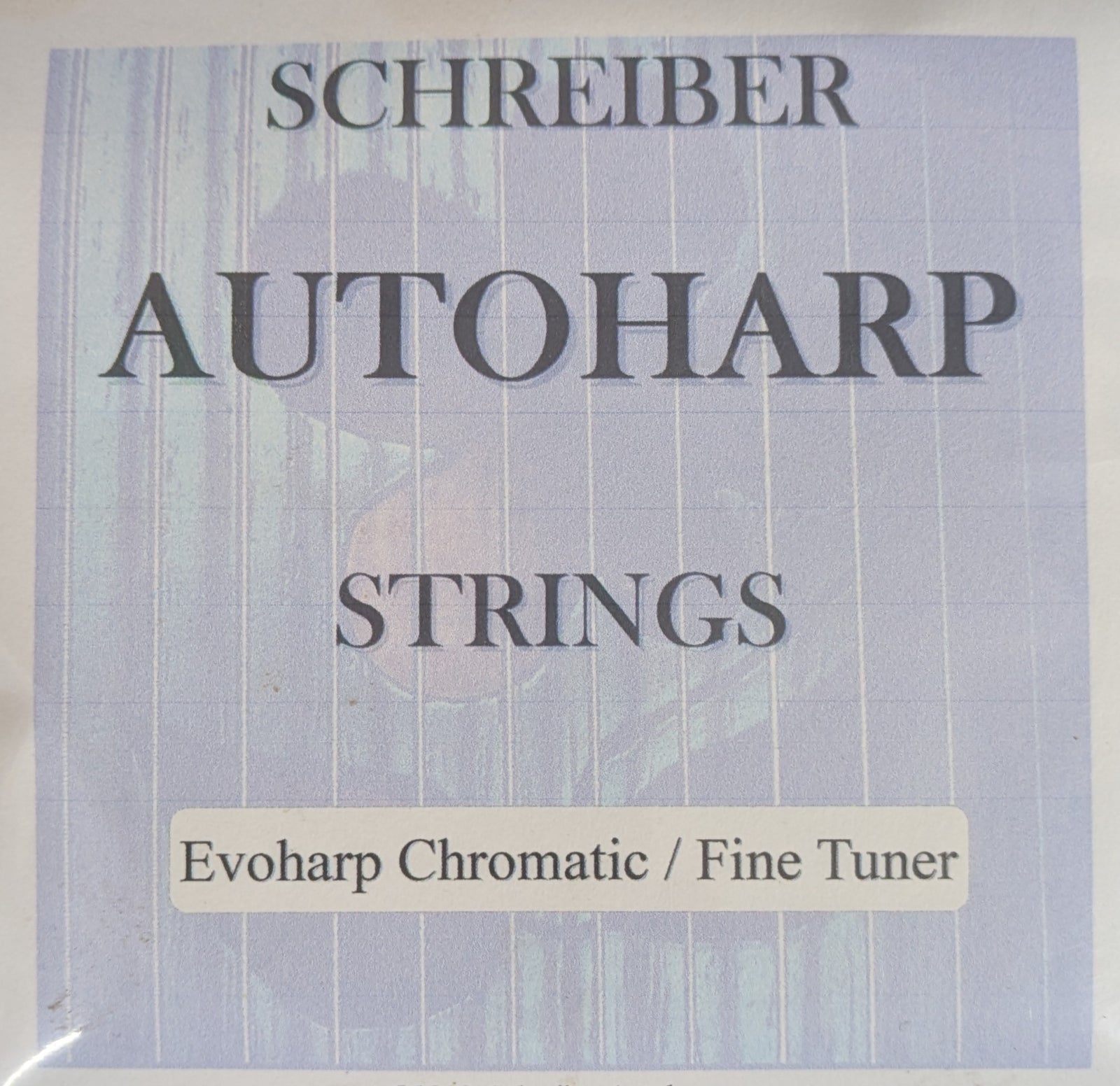 Upgrade your autoharp with the Autoharp String Set-Evo Chromatic/Fine Tuner, featuring packaging marked "Evoharp Chromatic / Fine Tuner" at the bottom—ideal for precise tuning and string set replacement.