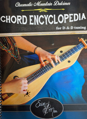 Cover of the "Chromatic Mountain Dulcimer Chord Encyclopedia by Mae," showing a person playing a chromatic mountain dulcimer, chord charts, and the author's name, Erin Mae, at the bottom.
