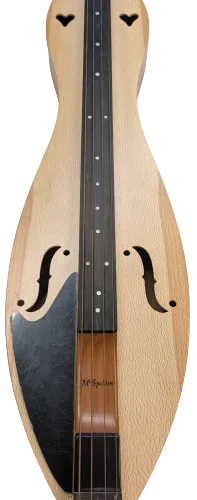 A close-up view of a left-handed dulcimer highlights its wooden body, strings, fretboard, and decorative sound holes, while the Pickguard-Left-Sided provides added protection to the instrument’s surface.