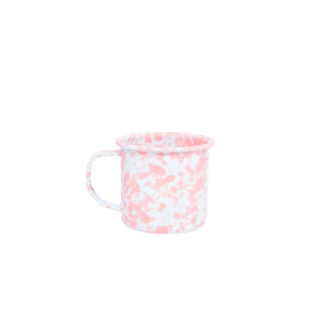 The Splatter Enamelware 12 oz Mug features a playful pink splatter design on classic white enamel, making it a vibrant addition to your colorful serveware collection. Displayed against a plain white background, this mug brings charm and personality to your drinkware.