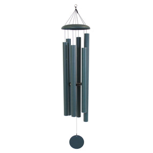 The Corinthian Bells® 65-inch Windchime features dark blue metal cylindrical tubes, a round disc top, and a circular wind catcher below, all designed to produce deep, resonant tones. Wholesale availability.