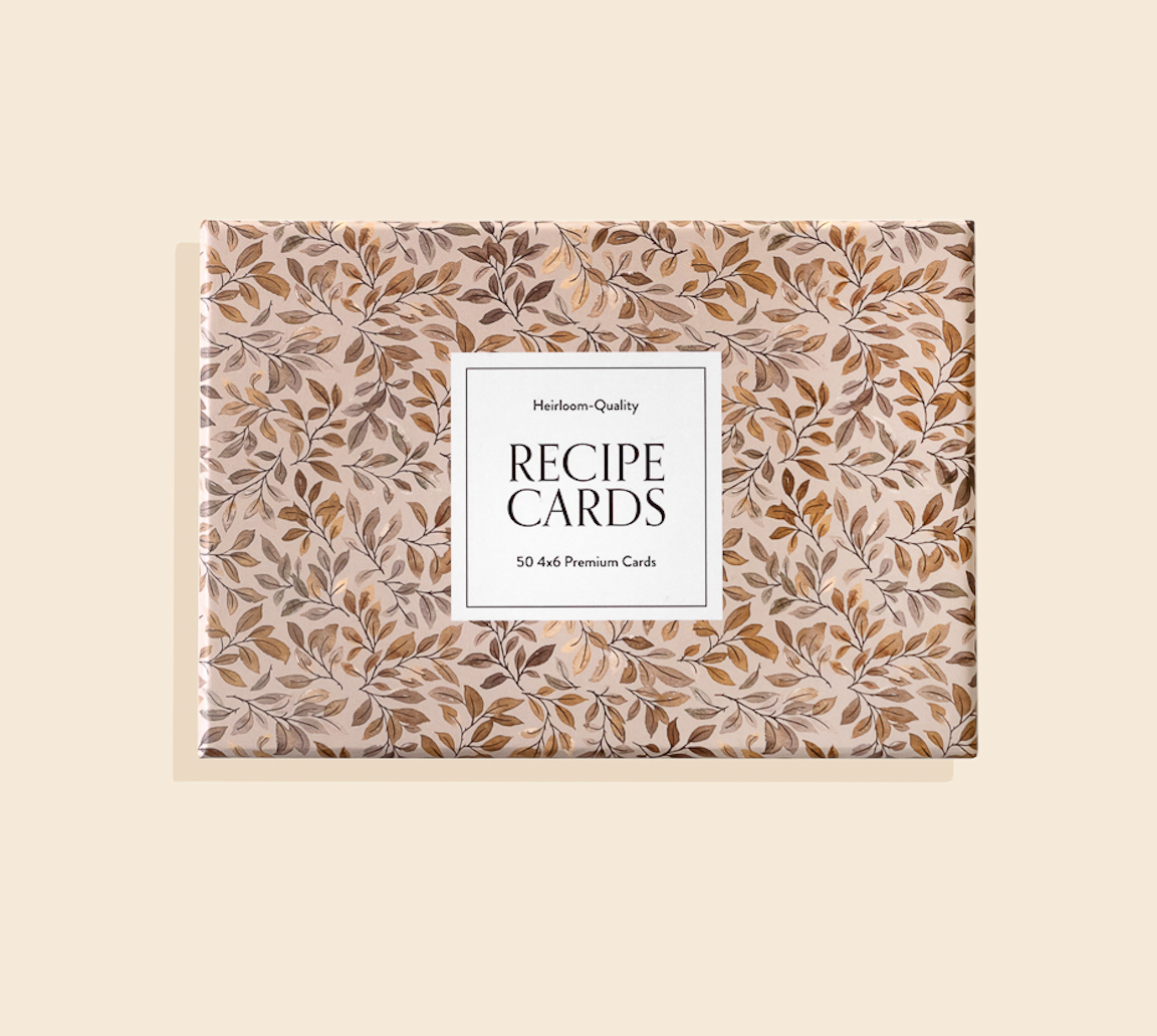 Recipe Cards 4x6: A box of 50 premium heirloom-quality cards featuring a gold and brown leafy design on beige. Ideal for kitchen or hostess gifts. Label reads "RECIPE CARDS, 50 4x6 Premium Cards.