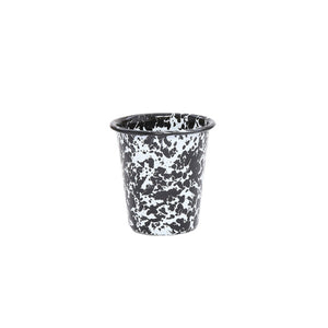 The Splatter Enamelware 10 oz Short Tumbler features a black and white splatter design. This small enamel cup is shown against a plain white background.