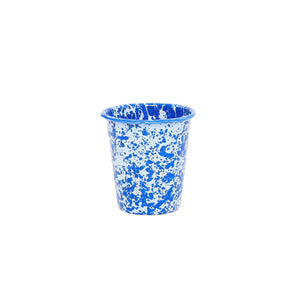 A Splatter Enamelware 10 oz Short Tumbler, featuring blue and white speckles, from our colorful drinkware collection is centered on a plain white background.