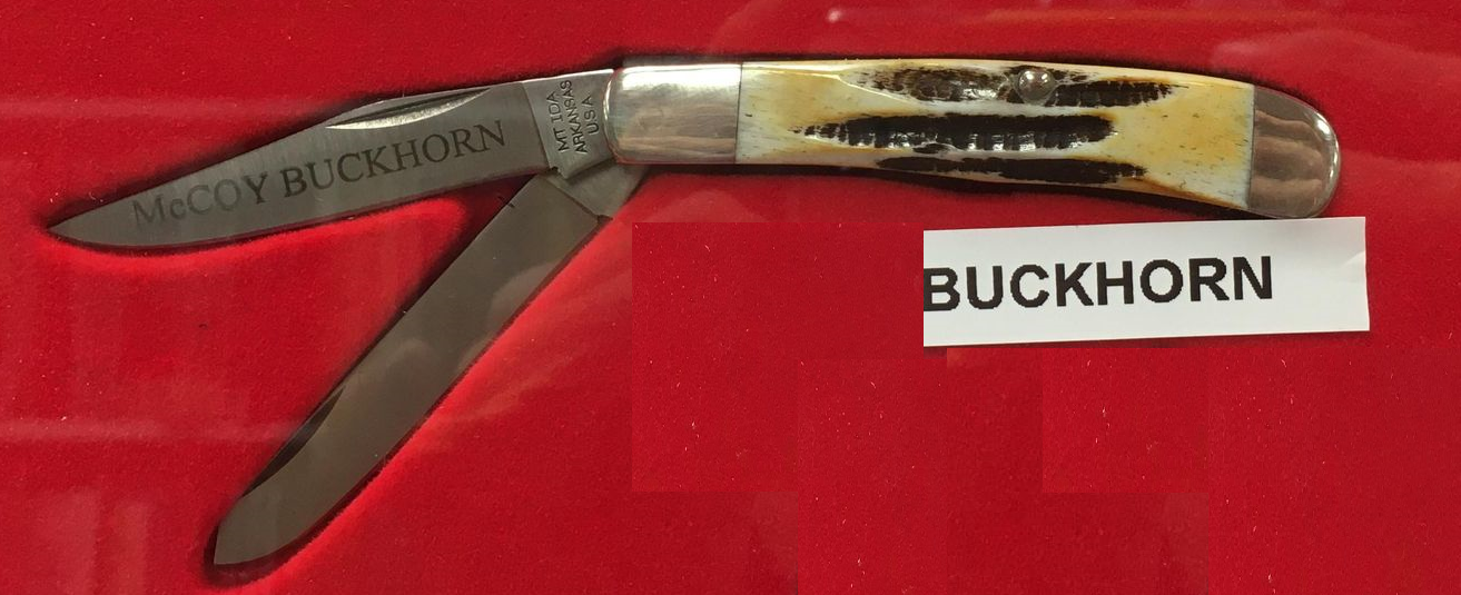A McCoy Buckhorn knife with a stag handle and sharp blades.