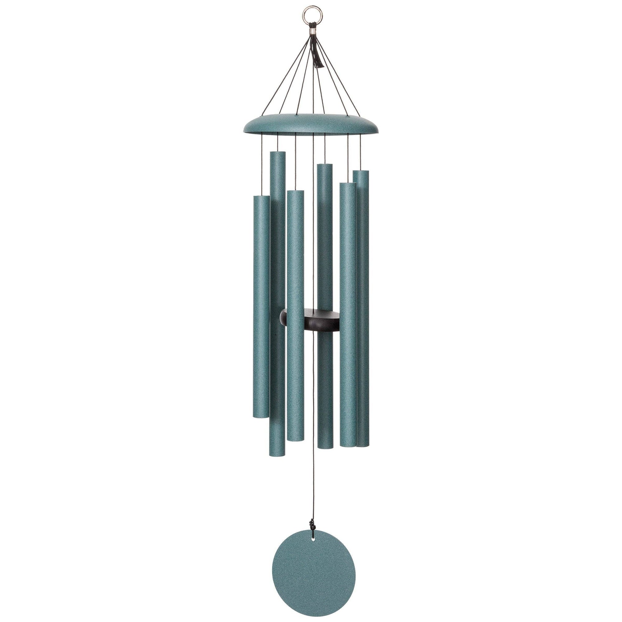 The Corinthian Bells® 36-inch Windchime in teal, featuring cylindrical tubes and a circular sail, is suspended from a metal ring by thin black cords.