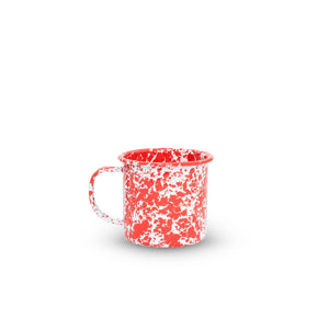 The Splatter Enamelware 16 oz Large Mug features a charming white background with red speckles, making it perfect for enjoying your favorite beverages.