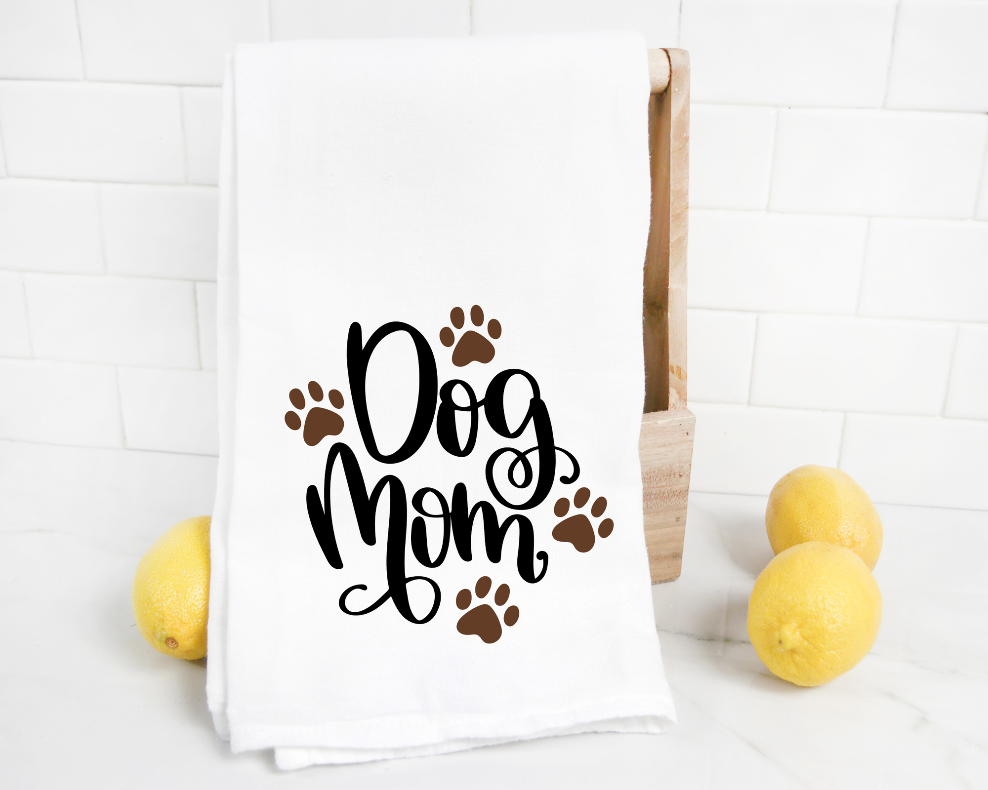 This adorable heat transfer vinyl Dog Mom Tea Towel features vibrant lemons and charming paw prints, making it the perfect dog mom gift.