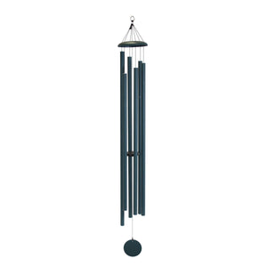 A Corinthian Bells® 74-inch wind chime hanging in a backyard retreat.