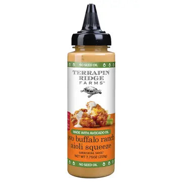A bottle of Terrapin Ridge Avo Buffalo Ranch Dressing with a black cap and white label.