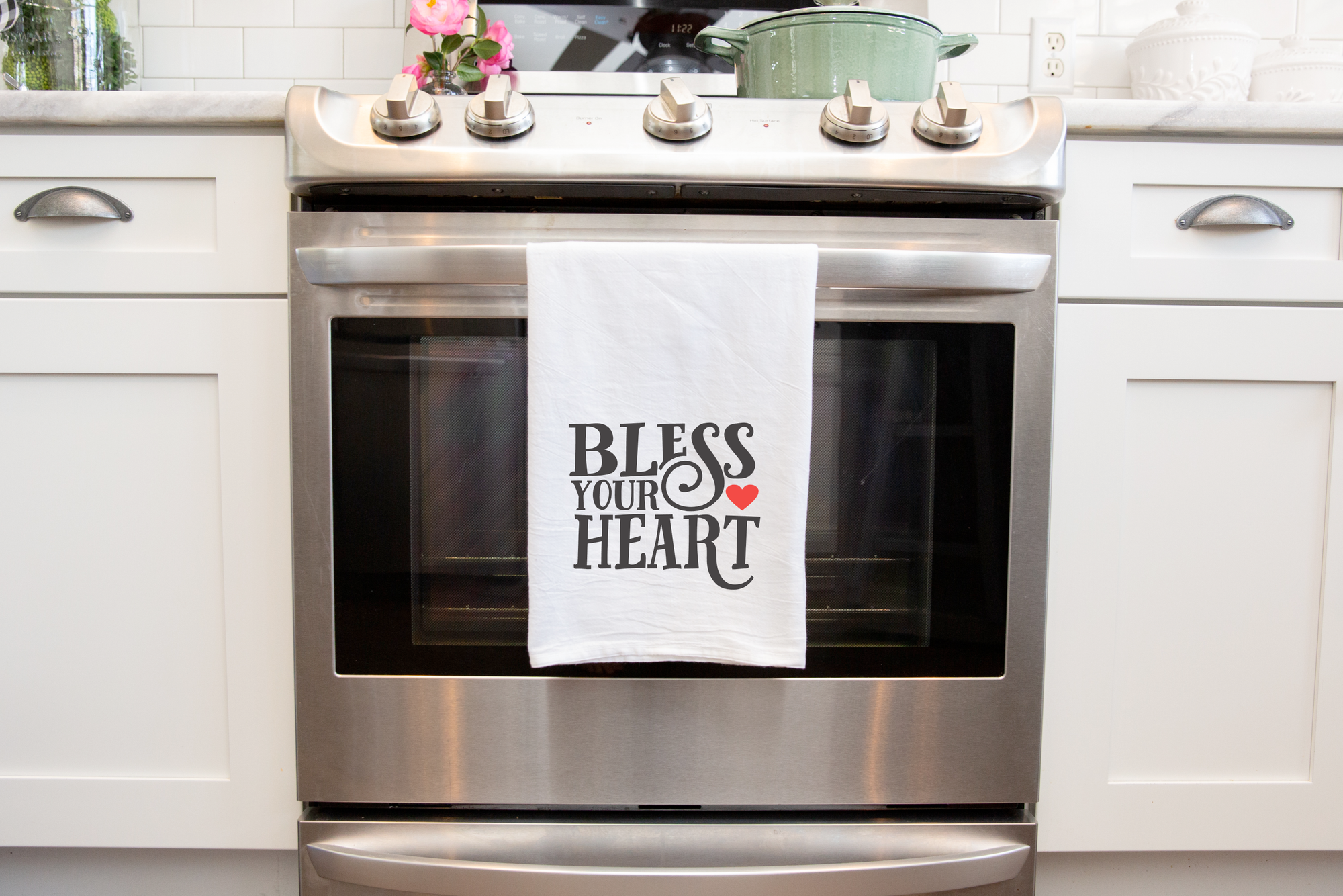 Southern pride Bless Your Heart Tea Towel with a touch of charm, featuring the heartfelt phrase "bless your heart.