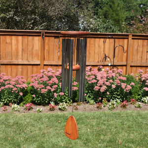 A Festival® 30-inch Windchime in a backyard.