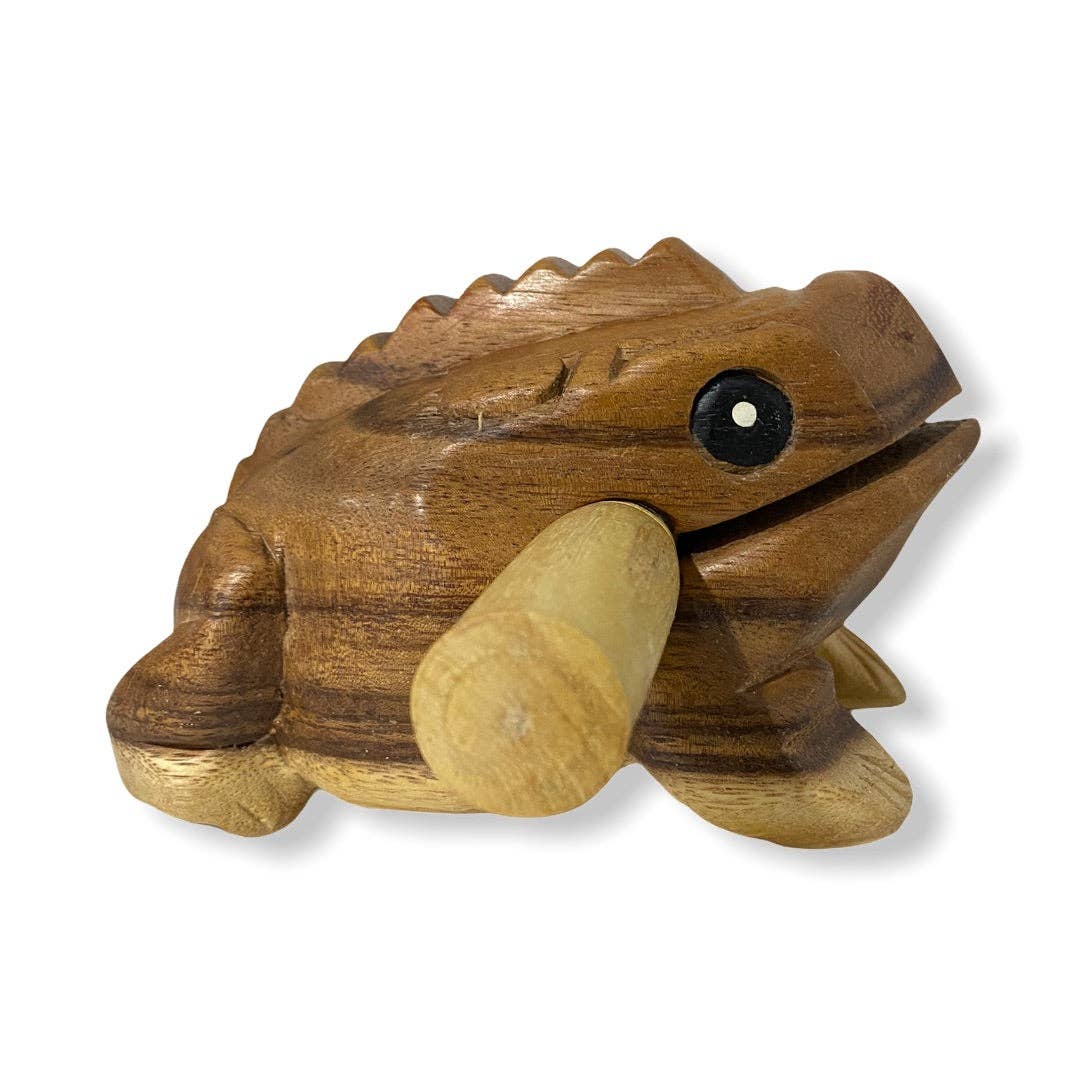 The **Natural wooden frog** is a wooden croaking frog-shaped percussion instrument featuring a stick that can be inserted into its mouth. By scraping the stick along its ridged back, it creates a distinctive sound. Handmade in Thailand, this instrument exemplifies quality craftsmanship.