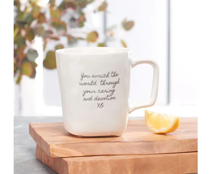 A Studio M coffee mug from the Heart Notes collection, featuring a lemon design and a delightful quote.